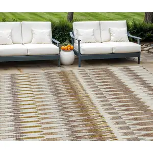 Photo of Brown Beige And Taupe Southwestern Washable Indoor Outdoor Area Rug