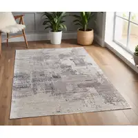 Photo of Brown Black and Tan Abstract Hand Tufted Area Rug