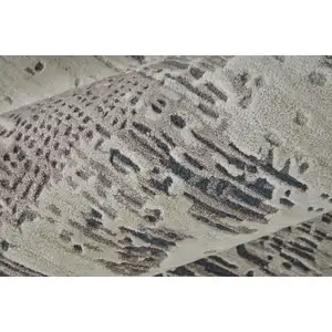 Photo of Brown Black and Tan Abstract Hand Tufted Area Rug