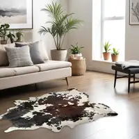 Photo of Brown Black and White Cowhide Hand Knotted Area Rug