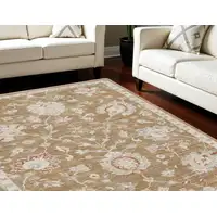 Photo of Brown Floral Power Loom Distressed Area Rug With Fringe