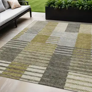 Photo of Brown Gold And Taupe Striped Washable Indoor Outdoor Area Rug