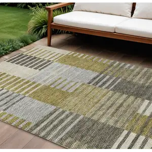 Photo of Brown Gold And Taupe Striped Washable Indoor Outdoor Area Rug