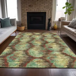 Photo of Brown Gold And Teal Blue Abstract Washable Indoor Outdoor Area Rug