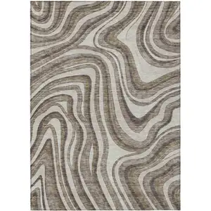 Photo of Brown Ivory And Taupe Abstract Washable Indoor Outdoor Area Rug