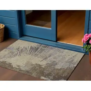 Photo of Brown Tan And Beige Abstract Washable Indoor Outdoor Area Rug