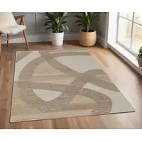 Photo of Brown Tan and Ivory Wool Abstract Hand Tufted Area Rug