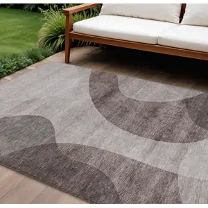 Photo of Brown Taupe And Beige Abstract Washable Indoor Outdoor Area Rug