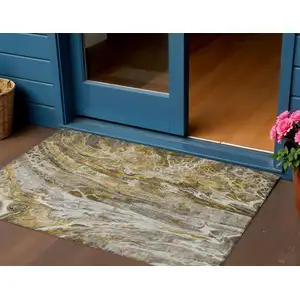 Photo of Brown Taupe And Gold Abstract Washable Indoor Outdoor Area Rug