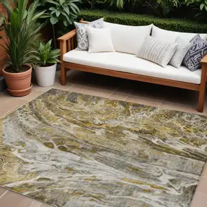 Photo of Brown Taupe And Gold Abstract Washable Indoor Outdoor Area Rug