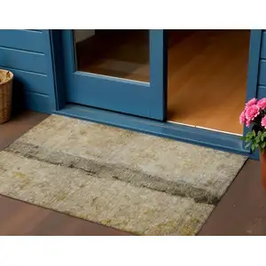 Photo of Brown Taupe And Gold Abstract Washable Indoor Outdoor Area Rug