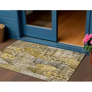 Photo of Brown Taupe And Gold Village Houses Washable Indoor Outdoor Area Rug