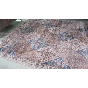 Photo of Brown and Blue Floral Distressed Area Rug