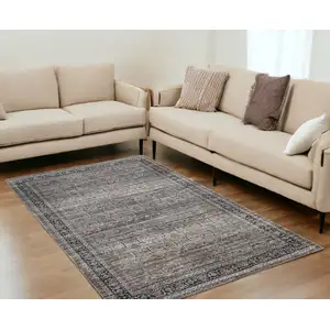 Photo of Brown and Blue Oriental Printed Distressed Area Rug