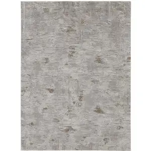 Photo of Brown and Ivory Abstract Power Loom Distressed Area Rug