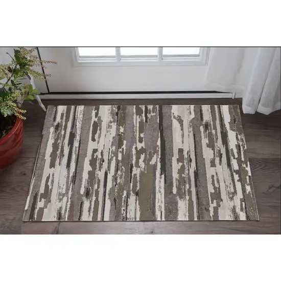 Brown and Ivory Abstract Power Loom Distressed Area Rug Photo 1