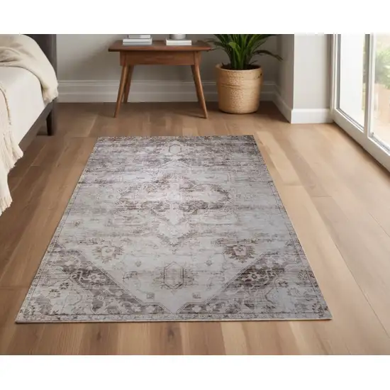 Brown and Ivory Oriental Area Rug Photo 1