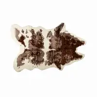 Photo of Brown and White Faux Cowhide Area Rug