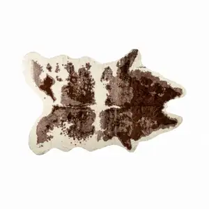 Photo of Brown and White Faux Cowhide Area Rug