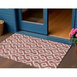 Photo of Burgundy And Ivory Geometric Washable Indoor Outdoor Area Rug