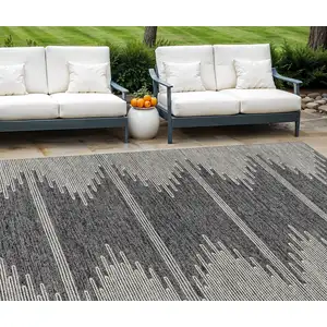 Photo of Charcoal And Ivory Abstract Washable Indoor Outdoor Area Rug