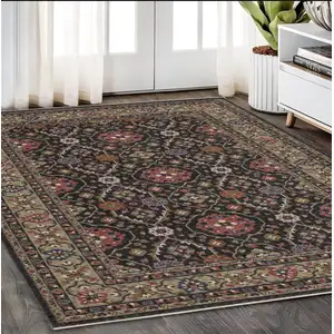 Photo of Charcoal And Pink Oriental Area Rug With Fringe