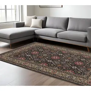 Photo of Charcoal And Pink Oriental Area Rug With Fringe