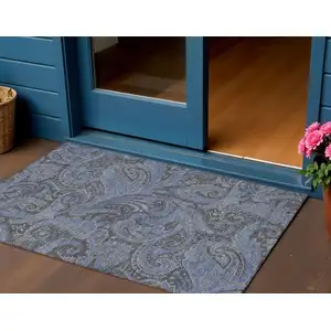 Photo of Charcoal Gray And Blue Paisley Washable Indoor Outdoor Area Rug