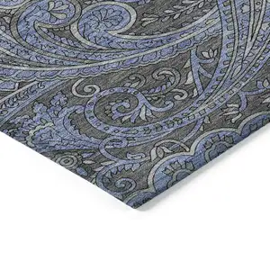 Photo of Charcoal Gray And Blue Paisley Washable Indoor Outdoor Area Rug