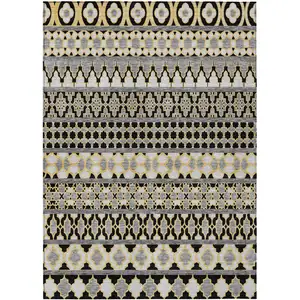 Photo of Charcoal Gray And Gold Quatrefoil Washable Indoor Outdoor Area Rug