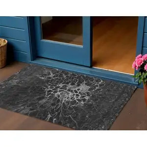 Photo of Charcoal Gray And Silver Abstract Washable Indoor Outdoor Area Rug