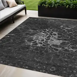 Photo of Charcoal Gray And Silver Abstract Washable Indoor Outdoor Area Rug