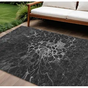 Photo of Charcoal Gray And Silver Abstract Washable Indoor Outdoor Area Rug