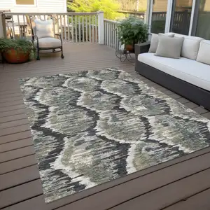 Photo of Charcoal Gray And Silver Abstract Washable Indoor Outdoor Area Rug