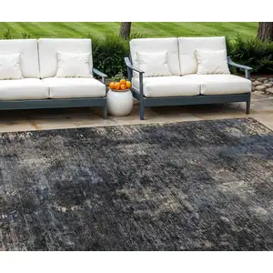 Photo of Charcoal Gray And Silver Abstract Washable Indoor Outdoor Area Rug