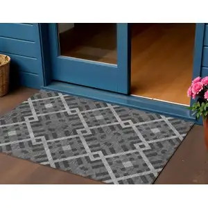 Photo of Charcoal Gray And Silver Geometric Washable Indoor Outdoor Area Rug