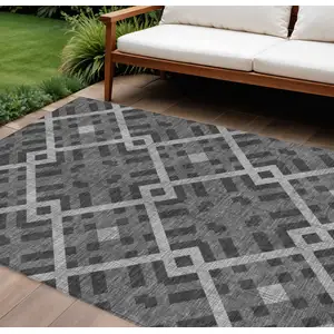 Photo of Charcoal Gray And Silver Geometric Washable Indoor Outdoor Area Rug