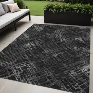 Photo of Charcoal Gray And Silver Geometric Washable Indoor Outdoor Area Rug