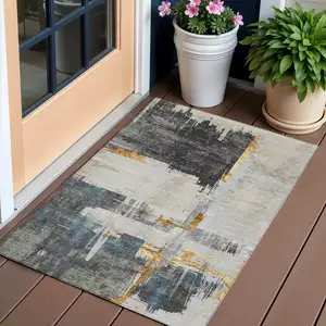 Photo of Charcoal Gray And Tan Abstract Washable Indoor Outdoor Area Rug