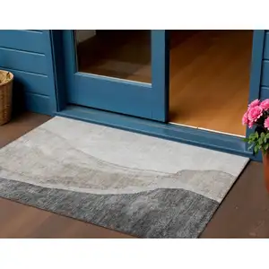 Photo of Charcoal Gray And Taupe Abstract Washable Indoor Outdoor Area Rug