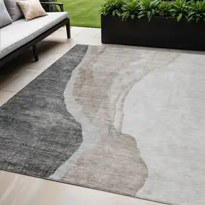 Photo of Charcoal Gray And Taupe Abstract Washable Indoor Outdoor Area Rug