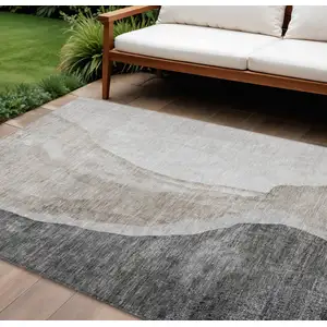 Photo of Charcoal Gray And Taupe Abstract Washable Indoor Outdoor Area Rug