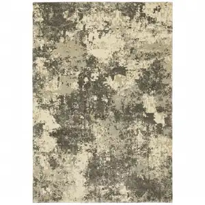 Photo of Charcoal Grey Beige And Tan Abstract Power Loom Stain Resistant Area Rug