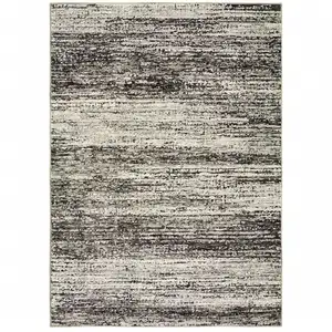 Photo of Charcoal Grey Silver And Ivory Abstract Power Loom Stain Resistant Area Rug