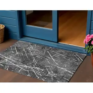 Photo of Charcoal Ivory And Gray Abstract Washable Indoor Outdoor Area Rug