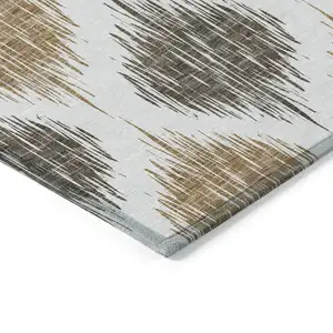 Photo of Chocolate And Ivory Ikat Washable Indoor Outdoor Area Rug