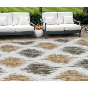 Photo of Chocolate And Ivory Ikat Washable Indoor Outdoor Area Rug