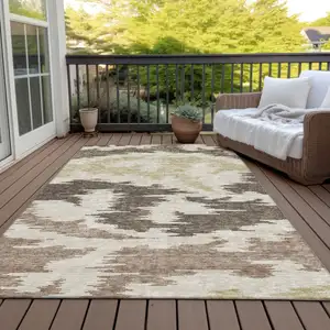 Photo of Chocolate Beige And Gold Abstract Washable Indoor Outdoor Area Rug