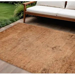 Photo of Copper Orange And Brown Oriental Washable Indoor Outdoor Area Rug