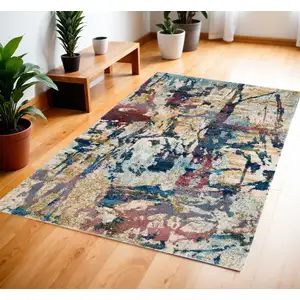 Photo of Cream Blue and Green Abstract Distressed Area Rug